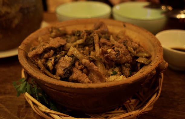 istock Mixed beef and pickled cabbage rice served in clay pot in a Vietnamese restaurant 2171197157