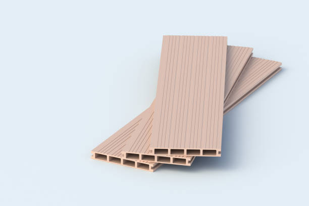 istock Heap of decking boards on gray background. Building materials. Siding planks. Modern composite panel for terrace. Home renovation. Copy space. 3d render 2171200781