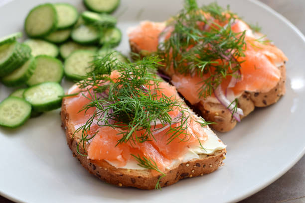 istock Multigrain bread toast with smoked salmon garnished with fresh dill and side sliced cucumbers 2171200936