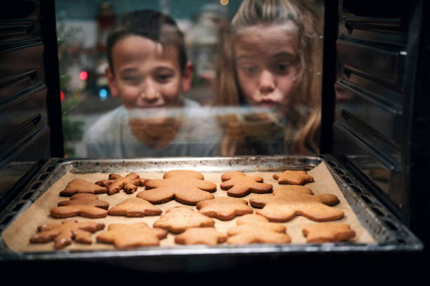 Baking Gingerbread Christmas Cookies in Domestic Kitchen