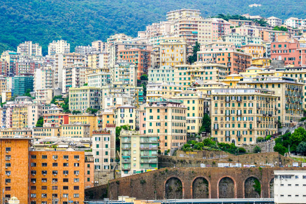 Genoa, Italy- May 27, 2024: Panoramic Genova cityscape, multilevel apartment buildings on the hillside