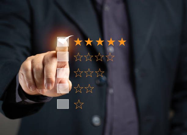 istock Man rates satisfaction using rating star on virtual screen. Concept of service satisfaction, survey, five star rating, highest satisfaction. Success business, quality service, survey feedback. 2171207674