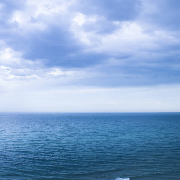 istock Calm windless ocean in blue tones. 2171215437