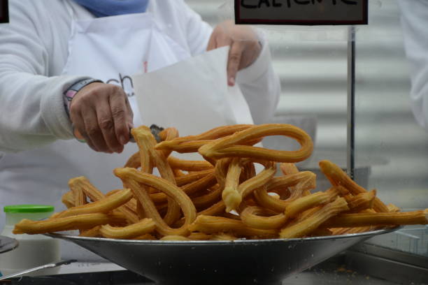 Madrid, Spain, December 26, 2015: Churros plate being prepared