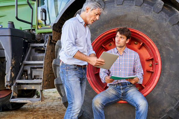 istock Farmer and agricultural advisor talking about crop quality and yield 2171217177