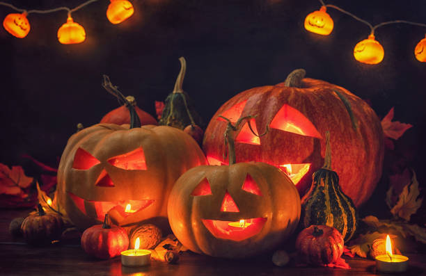 istock Jack O’ Lanterns on The Old Wooden Background 2171219505