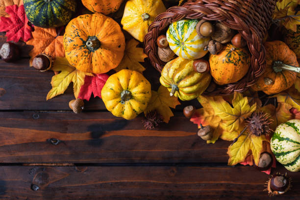 istock Decorated Autumn or Thanksgiving Cornucopia on a wooden background 2171219512