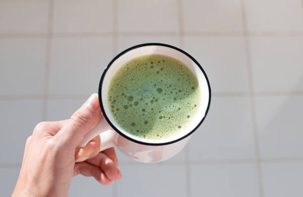 istock morning cup of Matcha in hand 2171220342