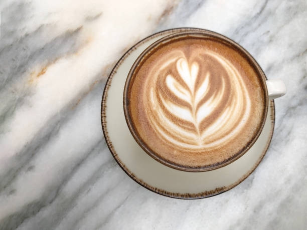 istock cappuccino coffee with latte art on marble table with copy space 2171220399
