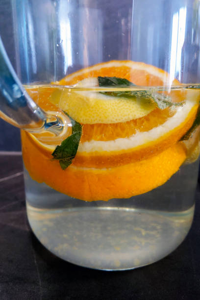 Refreshing Citrus and Mint Infused Water in a Glass Pitcher for Healthy Hydration