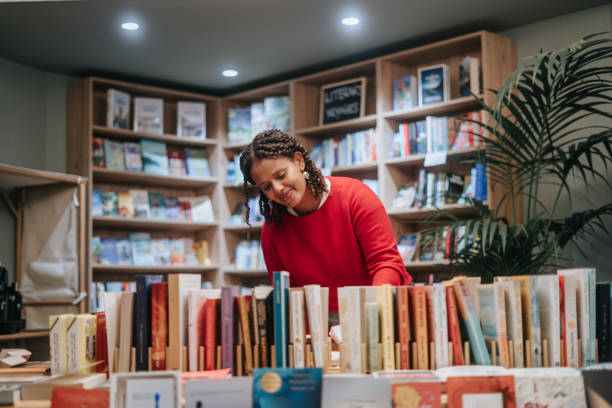 Woman buying books at store