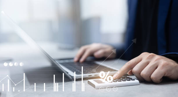 istock sales staff man hand press on calculator to calculate commission rate with virtual dashboard of growing profit chart report summary in office room for business enterprise and management cost concept 2171225489