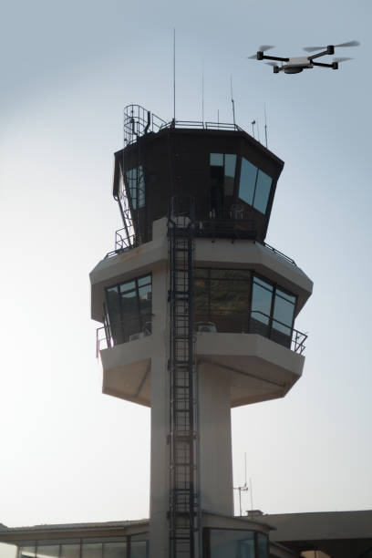 istock Drone flying over airport control tower on a sunny day 2171230283