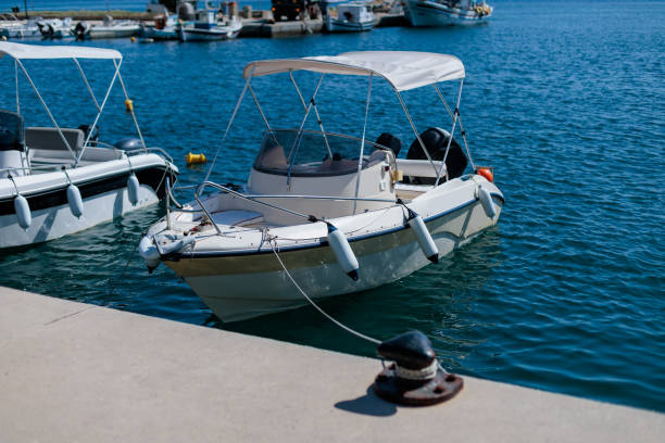 istock Rental boat docked at a marina on a sunny day 2171230292