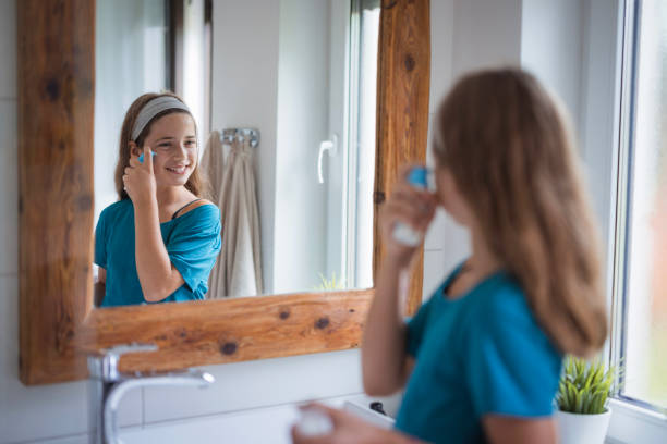 istock Happy young girl applying face serum 2171234790