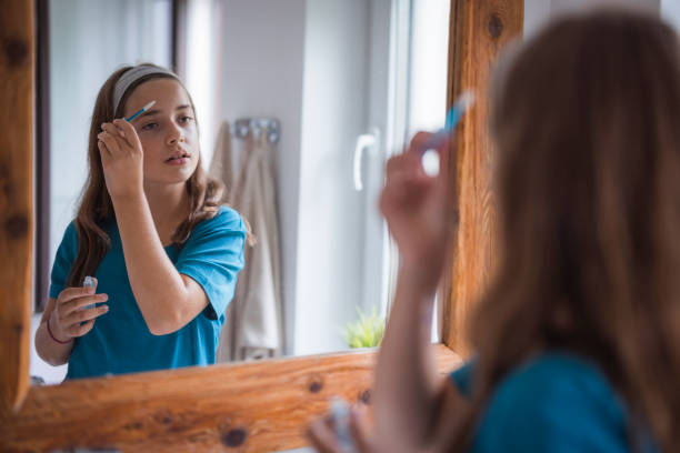 istock Teenage girl styling eyebrows 2171234876