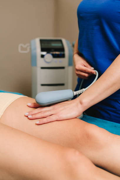 istock Tecar therapy to help with post surgery rehabilitation. Young athlete is going through diathermy to heal from sports leg trauma. Effective pain management. 2171235935
