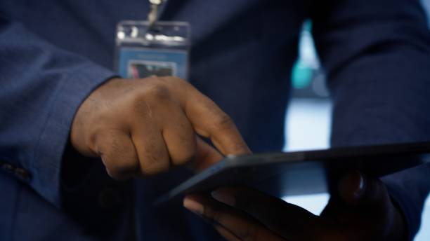istock Close up shot of man using tablet in data center, ensuring rigs are functioning 2171238936