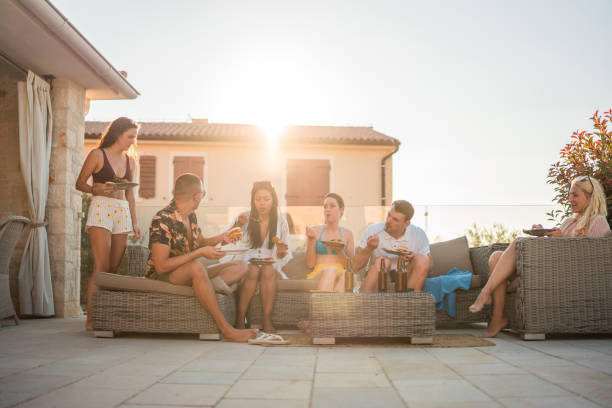istock Sunny Poolside Soiree with Diverse Friends 2171245779