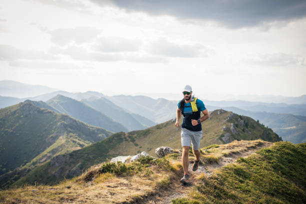 istock Man running on mountain trail, trail running. 2171246728