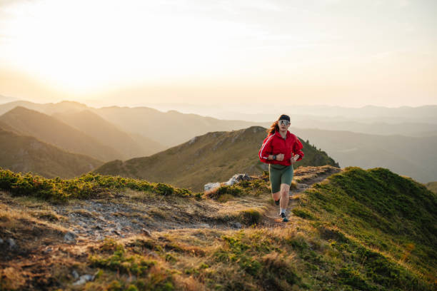istock Woman running on mountain trail, trail running. 2171247218