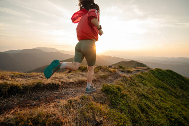 istock Woman running on mountain trail, trail running. 2171247220