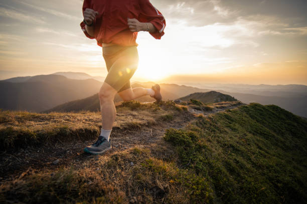istock Woman running on mountain trail, trail running. 2171247236
