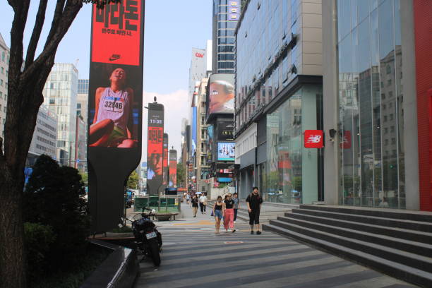 Seoul, South Korea-September 10, 2024: People walking down main commercial avenue in downtown Gangnam, Seoul