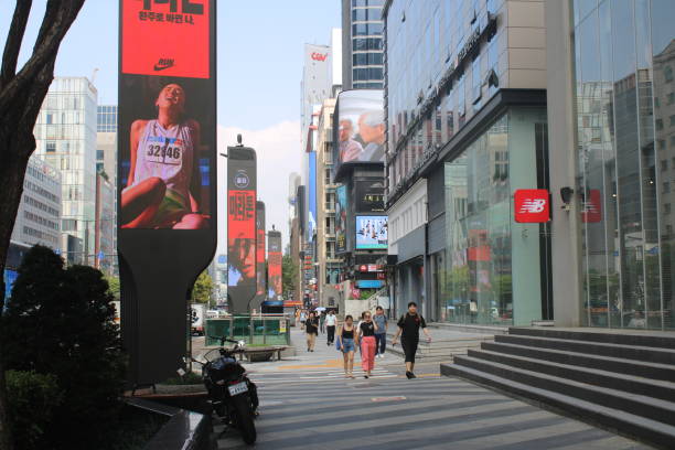 Seoul, South Korea-September 10, 2024: People walking down main commercial avenue in downtown Gangnam, Seoul