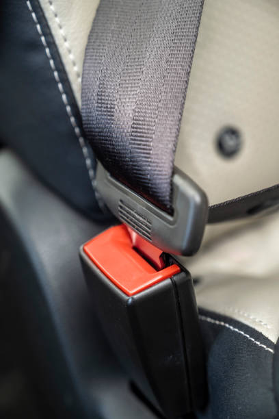 A car seat belt is red and black