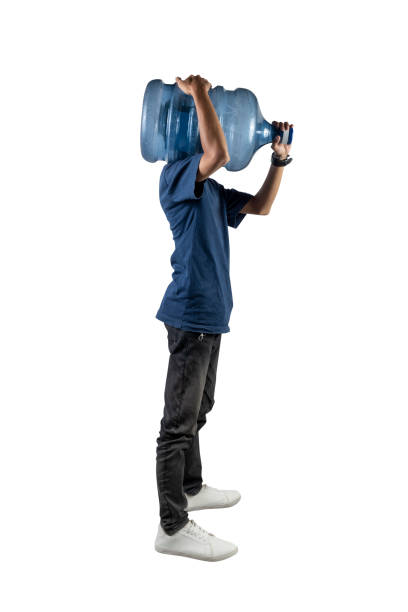 istock A man is holding a water gallon on his shoulder 2171260626