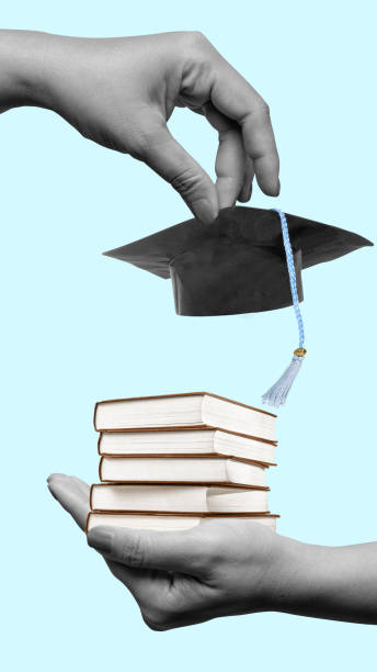 istock A hand holding a book and a cap 2171261640