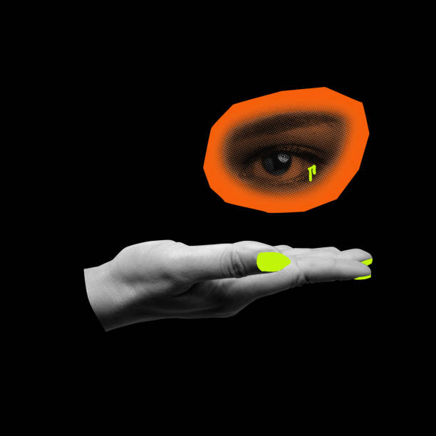 istock A hand showing an orange circle with a black background 2171263588