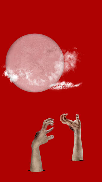 istock A red background with a large red full moon and two zombie hands raised from the ground 2171263600