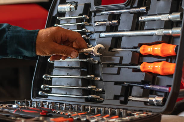 Close-up hand of a master with a set of tools