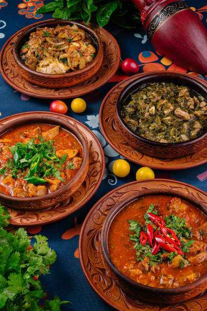istock Four georgian dishes served on a table with coriander and cherry plum 2171273810