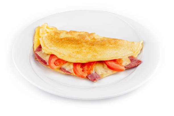 istock Folded omelette filled with cheese, ham and tomatoes on white plate 2171274642