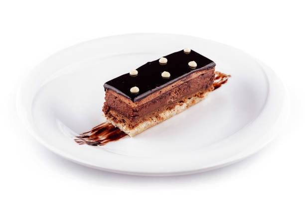 istock Delicious chocolate cake lying on white plate decorated with chocolate sauce 2171275056