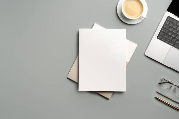 istock Organized Workspace Featuring Laptop and Blank Paper at Desk in Natural Light 2171277077