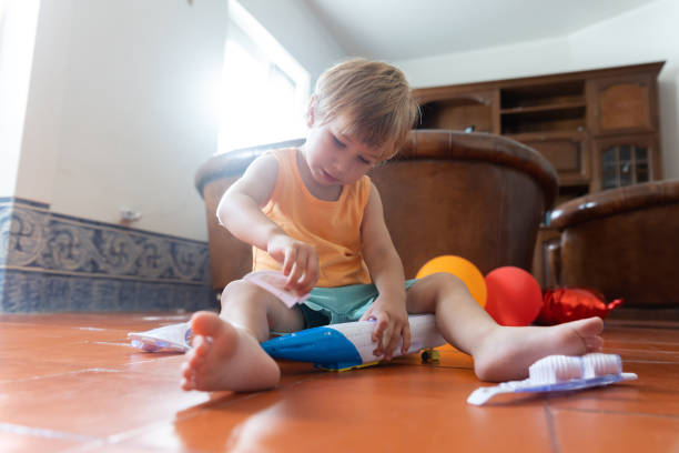 istock Little baby boy playing with toy airplane 2171281543