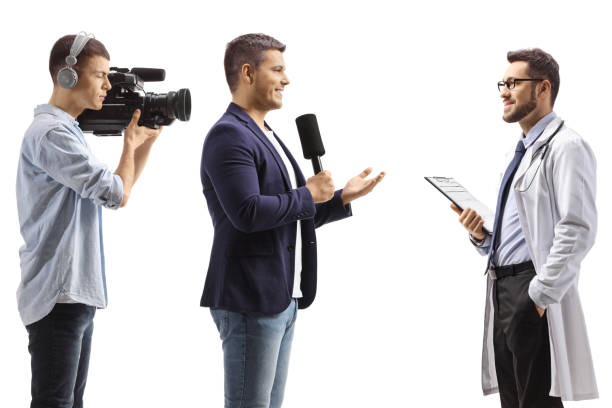 istock Reporter interviewing a doctor and a cameraman recording 2171281556