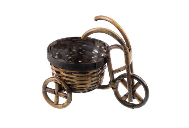 old wooden bicycle with basket isolated on white background
