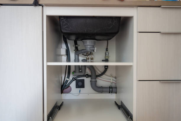 istock open cabinet with pipes under the sink in the kitchen 2171290520
