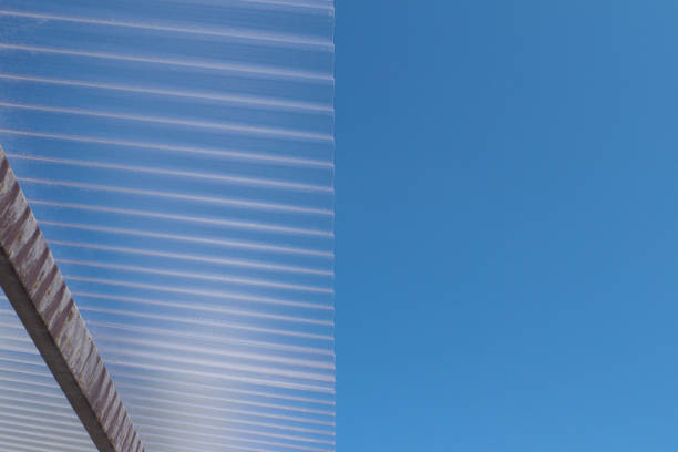Corrugated transparent plastic roof with blue sky background