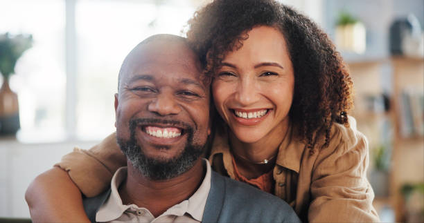 istock Couple, happy and hug portrait in home for romance, support and commitment in marriage with love. Interracial people, security and embrace in living room of house for loyalty, comfort and affection 2171298097