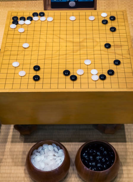 istock Go Board game with black and white stone Strategy board game 2171299246