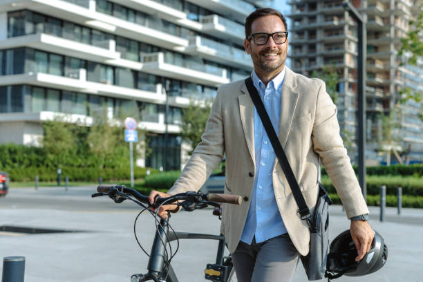 istock Confident man commuting by bicycle in urban environment 2171308002