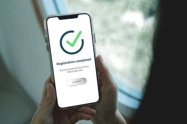 istock Smartphone screen shows Registration completed with Log in to proceed to the next step. 2171309418