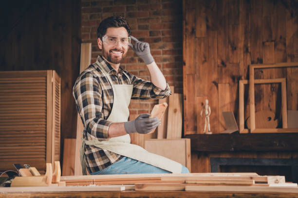 istock Photo of professional workman sit in garage work with plank timber 2171311310