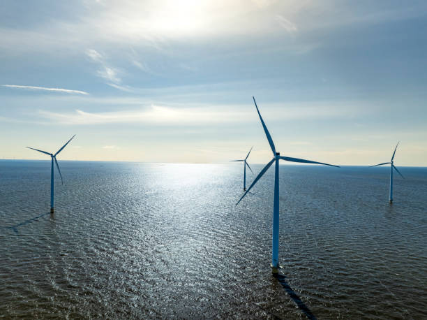 istock Wind turbines in an offshore wind park producing electricity 2171311928